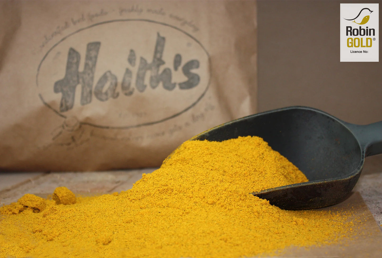 Haith's robin gold in a scoop with a vibrant gold colouring