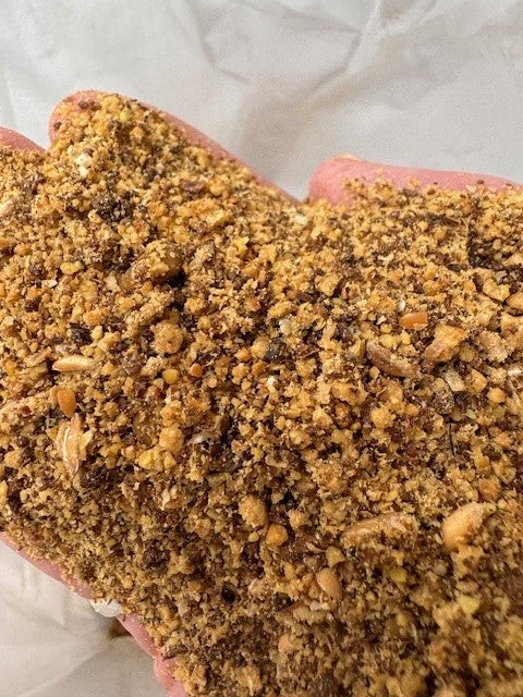 hand holding a soft bird food